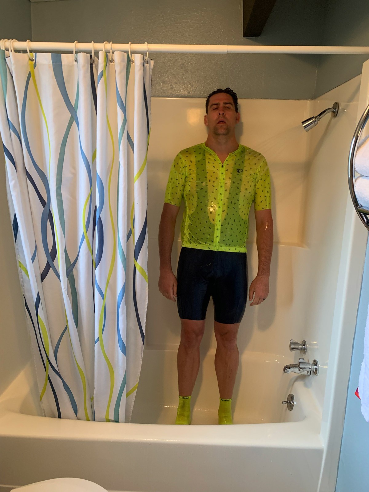 Rob in bike gear in the shower after the ride.