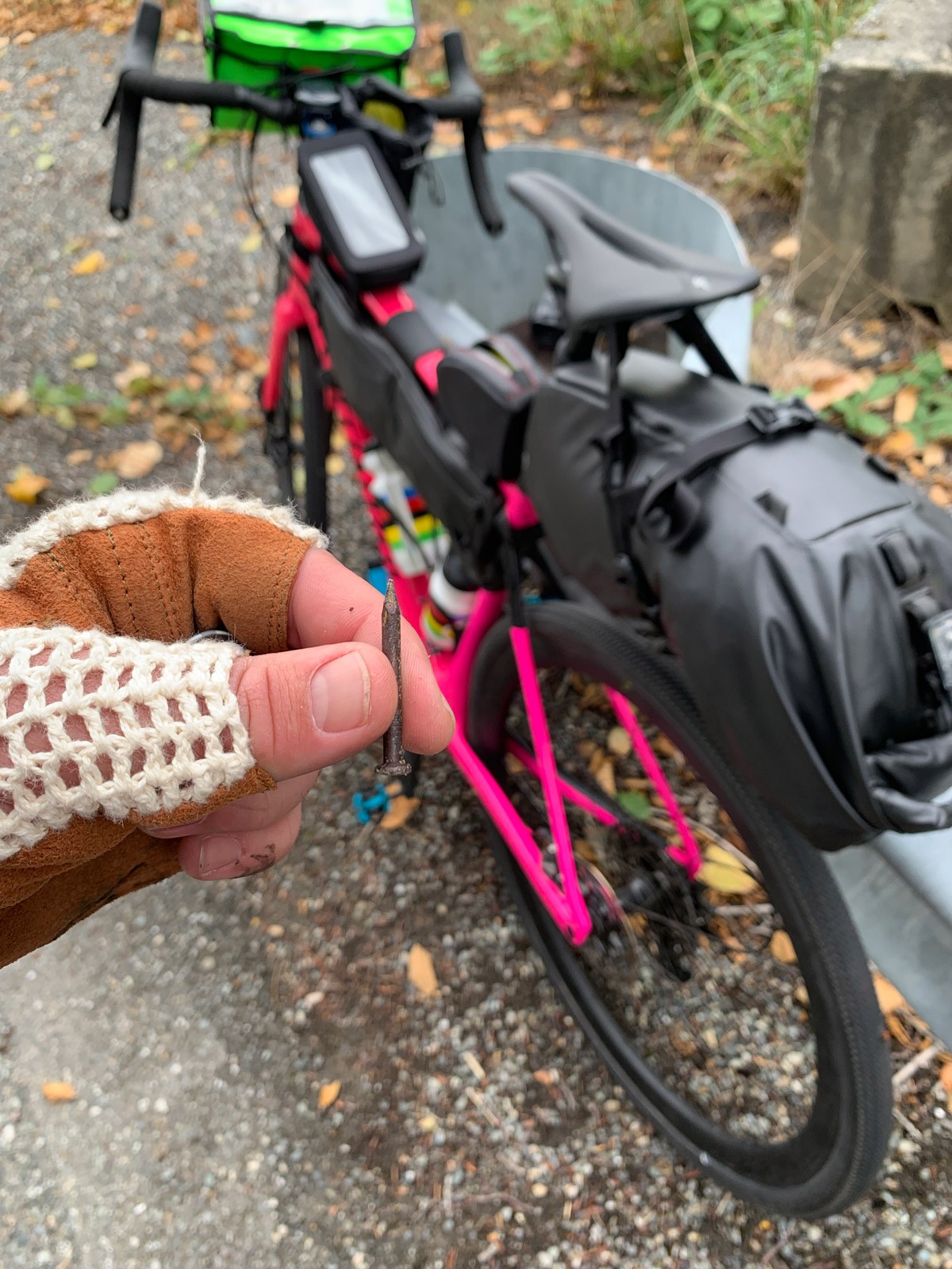 Rob holding the nail that was extracted from bike tire. 